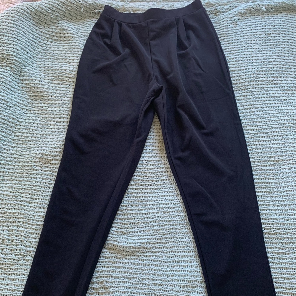 Black, stretchy, “jersey” styled pant.